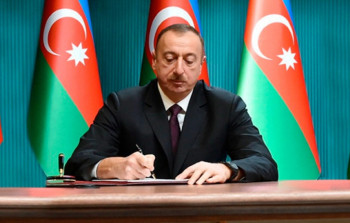 Dövlət dili normalarını pozanlar cərimələnəcək - Prezident qanunu imzaladı